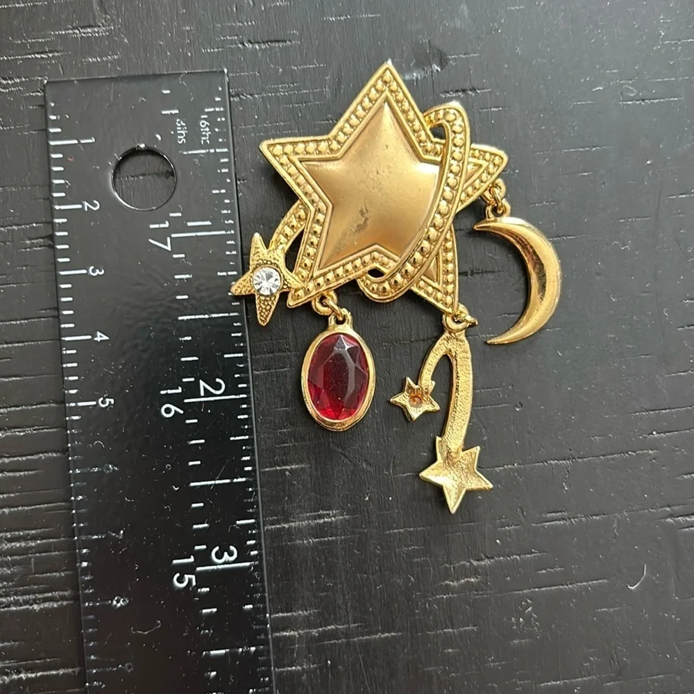 Gold Celestial Dangle Star and Moon Brooch with Red Gemstone​